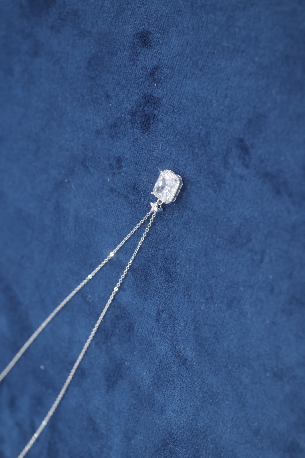 An elegant, classic halo pendant necklace.