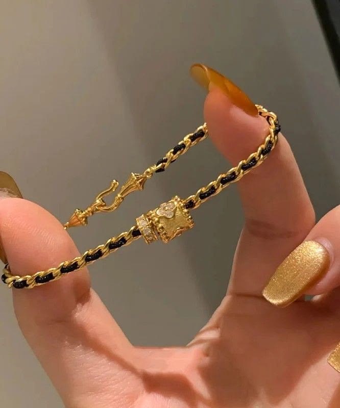 Elegant Woven Gold & Black Cord Barrel Bracelet