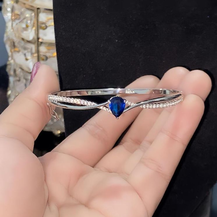 Elegant Pear-Cut Blue Sapphire Crossover Bangle