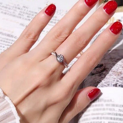 Modern Bypass / Swirl engagement ring