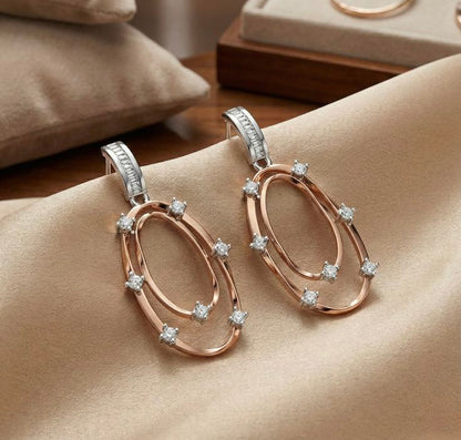Two-tone geometric drop/dangle earrings.