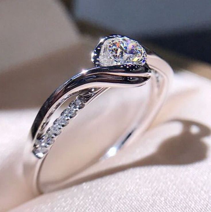 Modern Bypass / Swirl engagement ring
