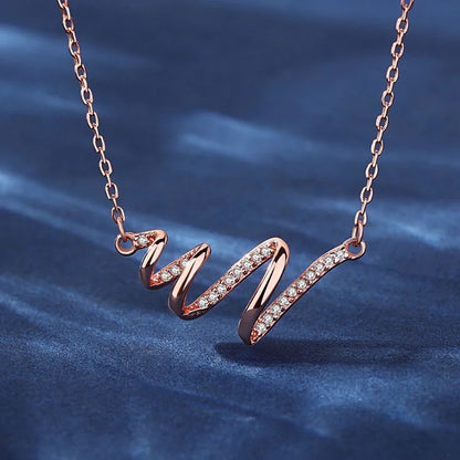 Elegant Rose Gold Spiral Ribbon Pendant Necklace