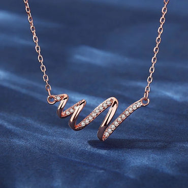 Elegant Rose Gold Spiral Ribbon Pendant Necklace